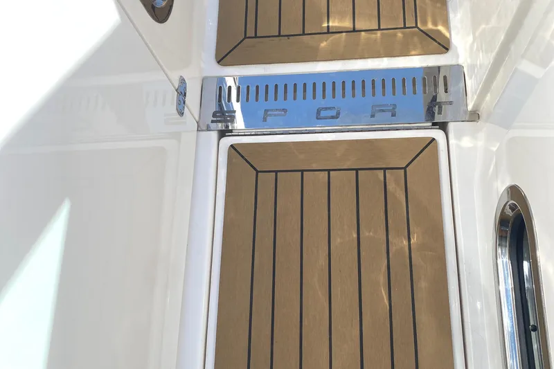 Slide: The Image of Teak deck of 2021 Tiara Yachts 38LX with "SPORT" metal detail. - 17
