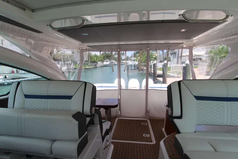 Slide: The Image of Interior view of 2021 Tiara Yachts 38LX, featuring luxurious seating and waterfront backdrop. - 22