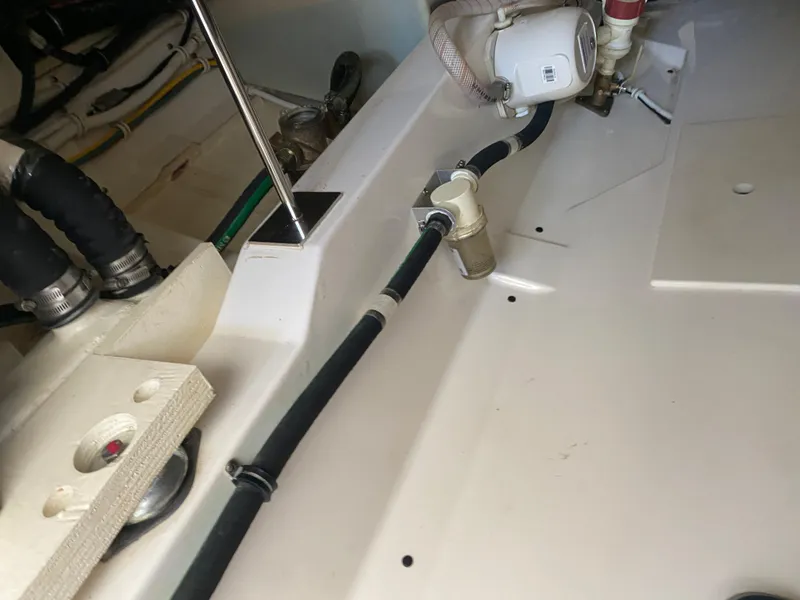 Slide: The Image of Engine compartment of a 2021 Tiara Yachts 38LX, showcasing hoses and fittings. - 30