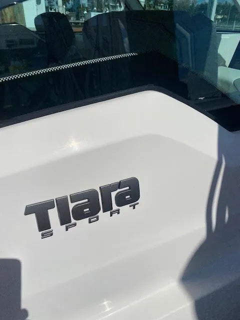 Slide: The Image of 2021 Tiara Yachts 38LX logo on white surface, close-up view. - 35
