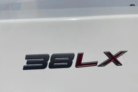 Slide: The Image of Tiara Yachts 2021 38LX model logo on white surface. - 36