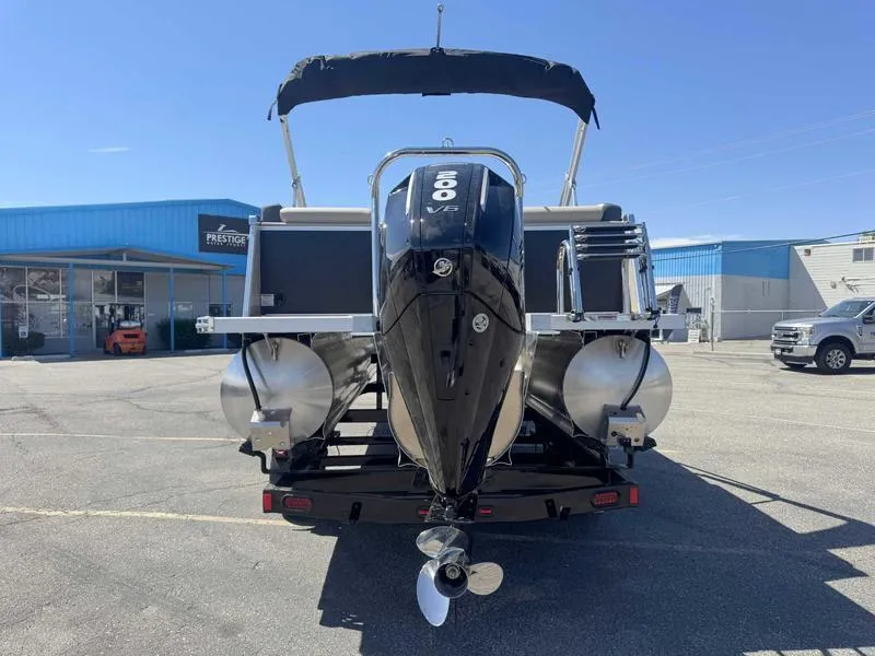 Slide: The Image of 2025 Avalon 2385 25 Catalina QL pontoon boat with powerful outboard motor, parked outdoors. - 4