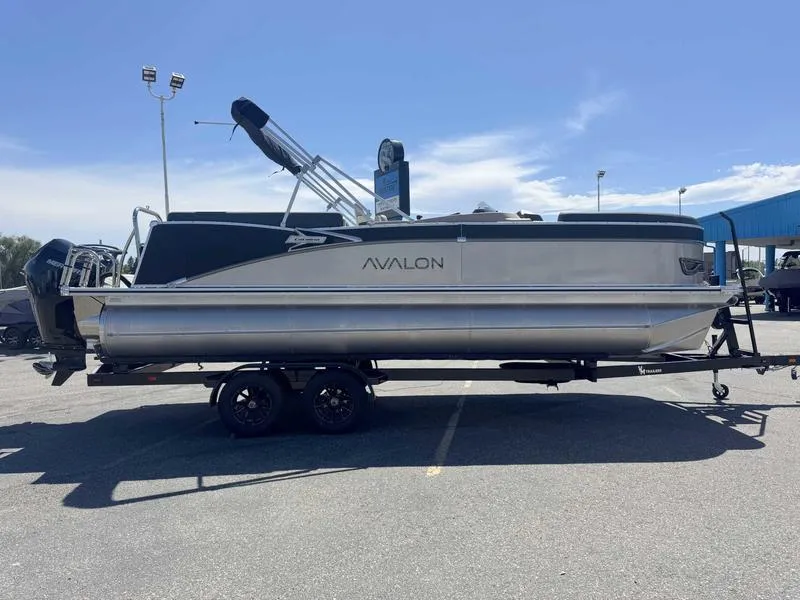 Slide: The Image of 2025 Avalon 2385 25 Catalina QL pontoon boat on trailer in parking lot. - 6