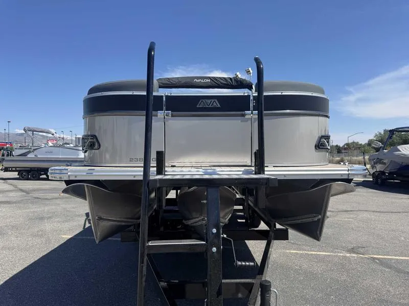 Slide: The Image of 2025 Avalon 2385 25 Catalina QL pontoon boat on trailer, parked outdoors. - 7