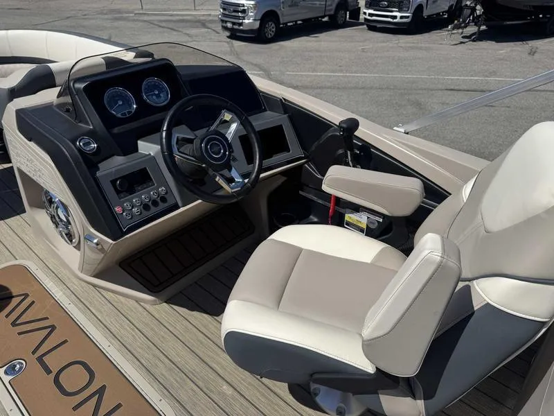 Slide: The Image of 2025 Avalon 2385 25 Catalina QL boat cockpit with steering wheel and control panel. - 8