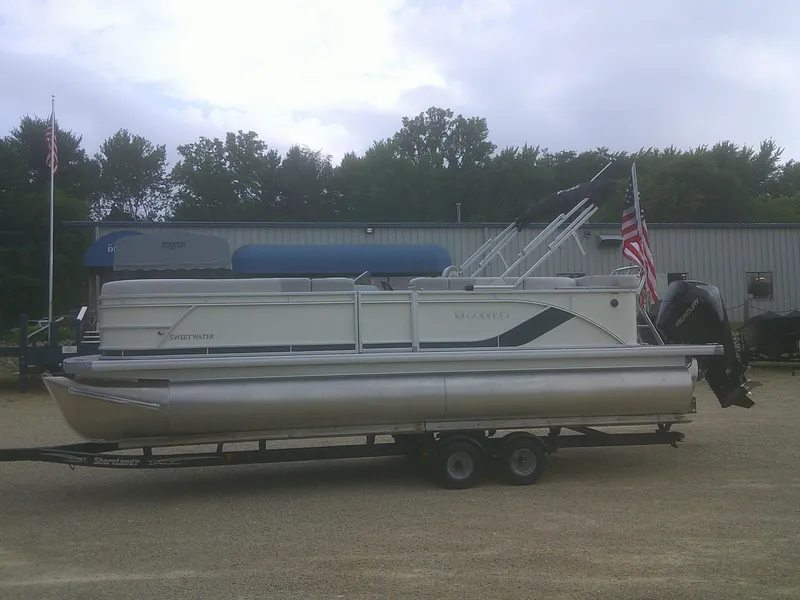 The Image of 2026 Godfrey 2286 Sweetwater Cruise Special Edition pontoon boat on trailer. - 1