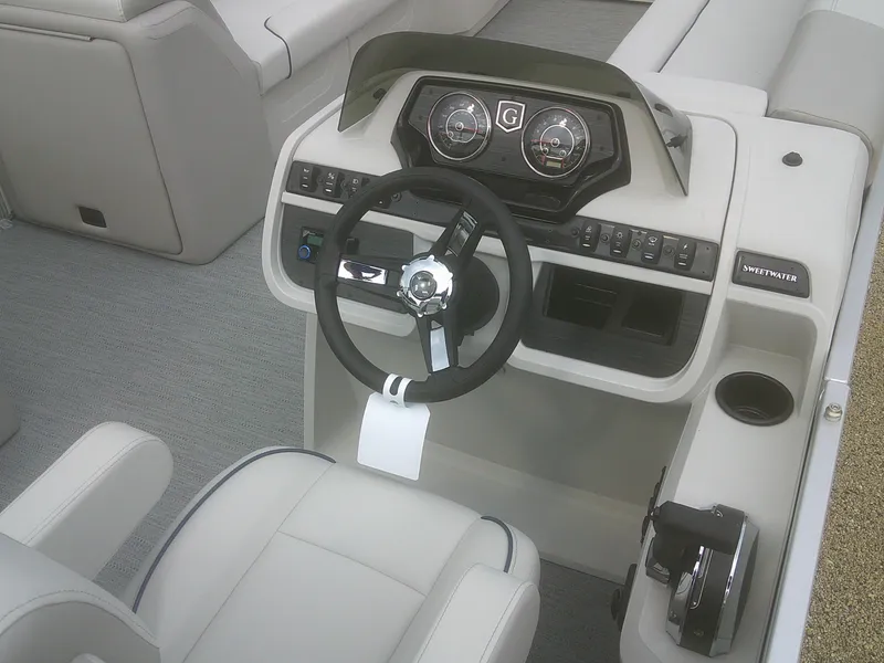 Slide: The Image of 2026 Godfrey 2286 Sweetwater Cruise Special Edition boat dashboard and steering wheel. - 11
