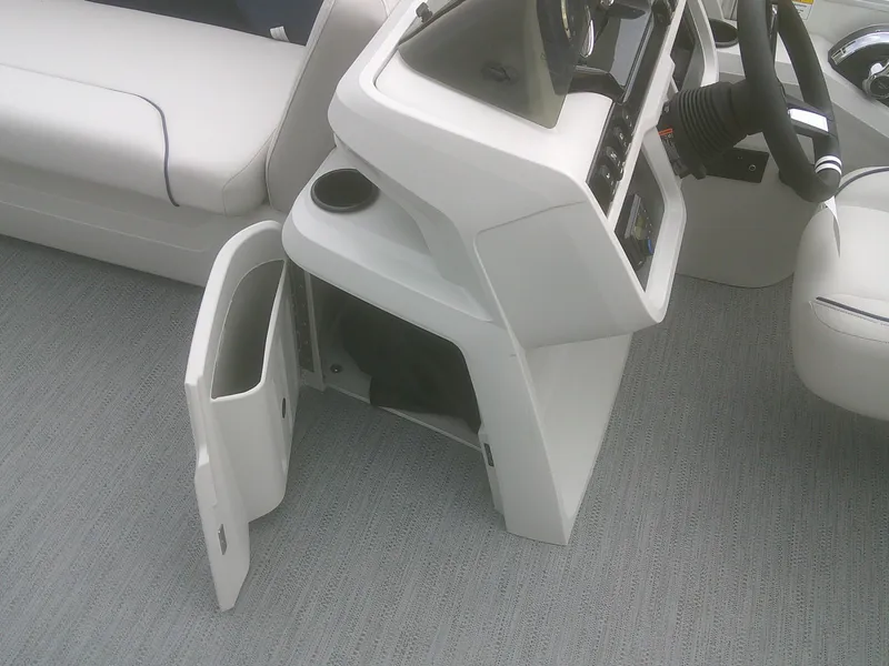 Slide: The Image of Interior of 2026 Godfrey 2286 Sweetwater Cruise, featuring helm and storage compartment. - 13