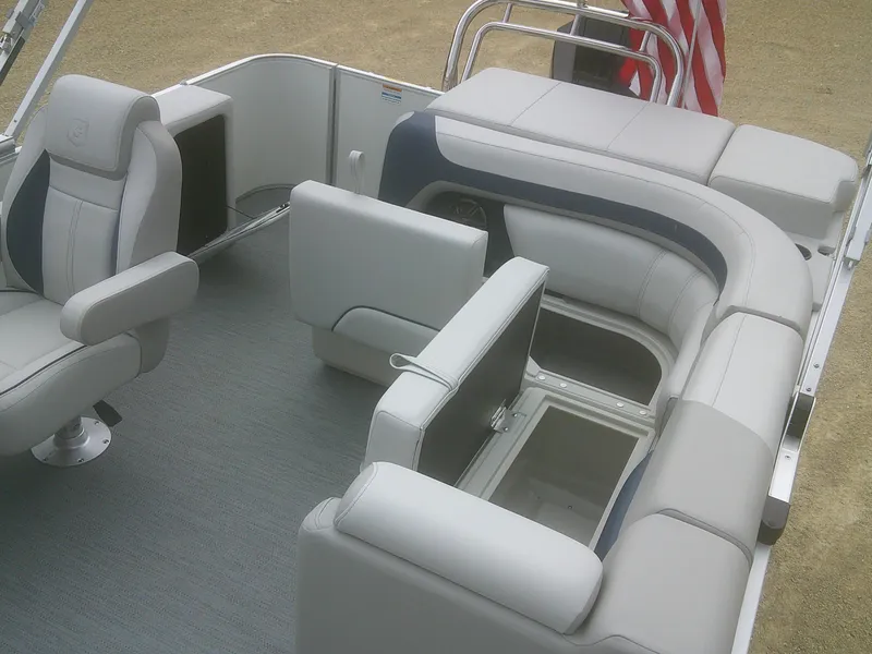 Slide: The Image of 2026 Godfrey 2286 Sweetwater Cruise Special Edition boat interior with plush seating and storage. - 14