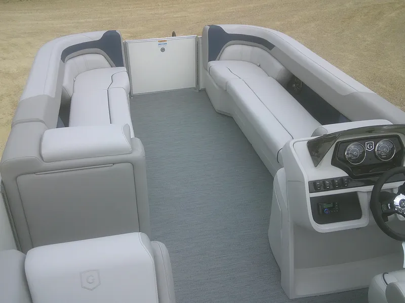 Slide: The Image of 2026 Godfrey 2286 Sweetwater Cruise Special Edition boat interior with plush seating and modern dashboard. - 6