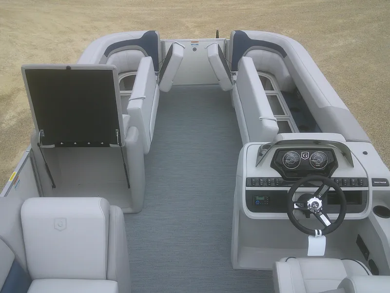 Slide: The Image of 2026 Godfrey 2286 Sweetwater Cruise Special Edition pontoon boat interior with plush seating and modern dashboard. - 7