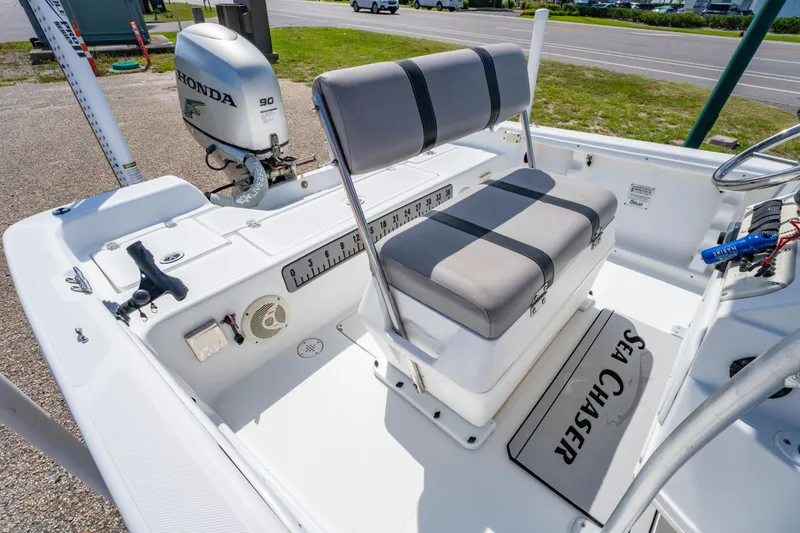 Slide: The Image of 2008 Sea Chaser 170 Bay Runner boat interior with Honda engine and seating. - 10