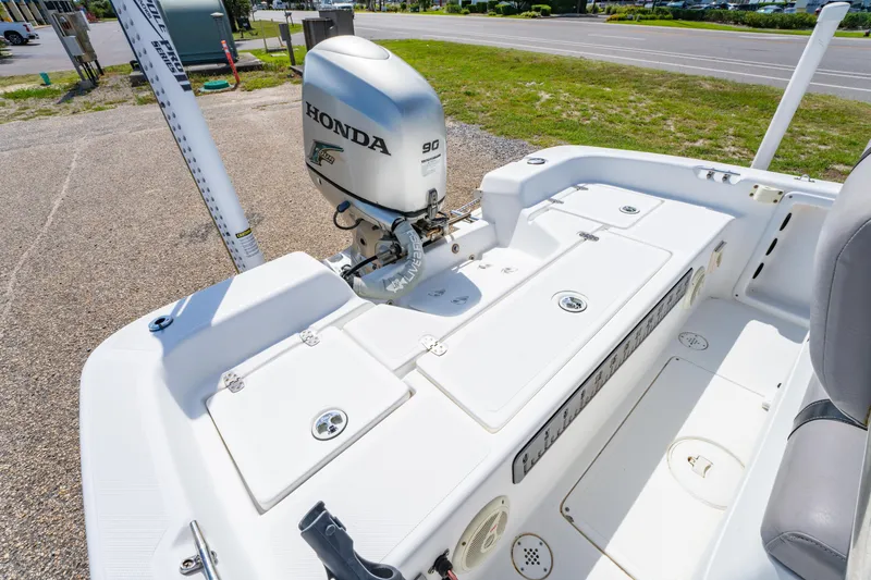 Slide: The Image of 2008 Sea Chaser 170 Bay Runner with Honda 90 outboard motor, parked on pavement. - 11