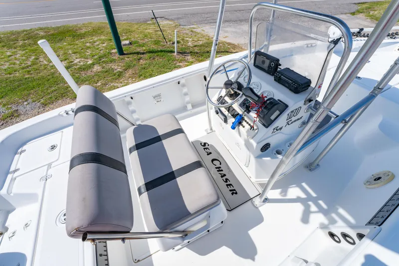 Slide: The Image of 2008 Sea Chaser 170 Bay Runner boat interior with steering console and seating. - 14