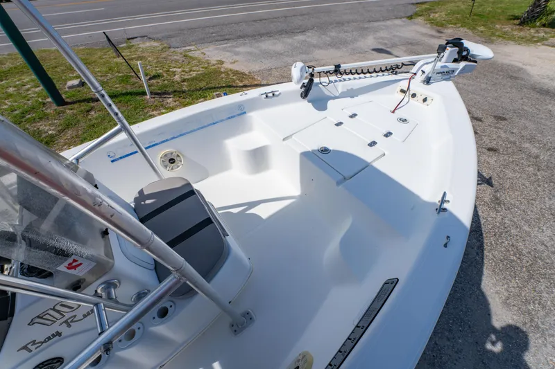 Slide: The Image of 2008 Sea Chaser 170 Bay Runner boat, white deck, equipped with trolling motor, parked on pavement. - 17