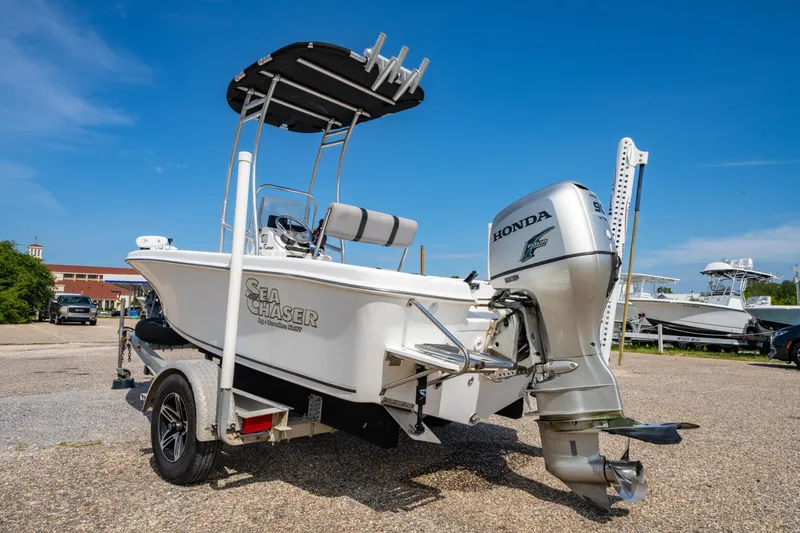 Slide: The Image of 2008 Sea Chaser 170 Bay Runner boat with Honda outboard motor on trailer. - 5