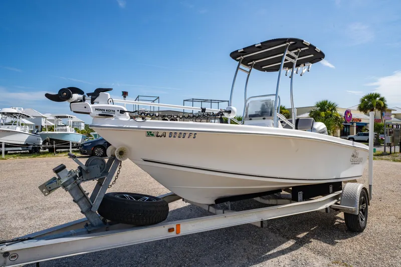 Slide: The Image of 2008 Sea Chaser 170 Bay Runner boat on trailer, sunny day, Minn Kota motor visible. - 7
