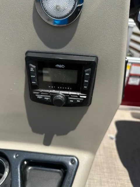 Slide: The Image of 2024 Sun Tracker Bass Buggy 16 XL Select stereo system close-up. - 11