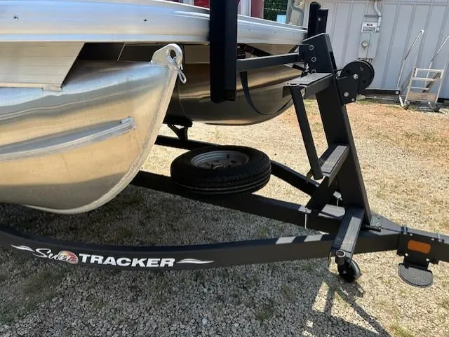 Slide: The Image of 2024 Sun Tracker Bass Buggy 16 XL Select on trailer, showcasing pontoon and trailer details. - 3