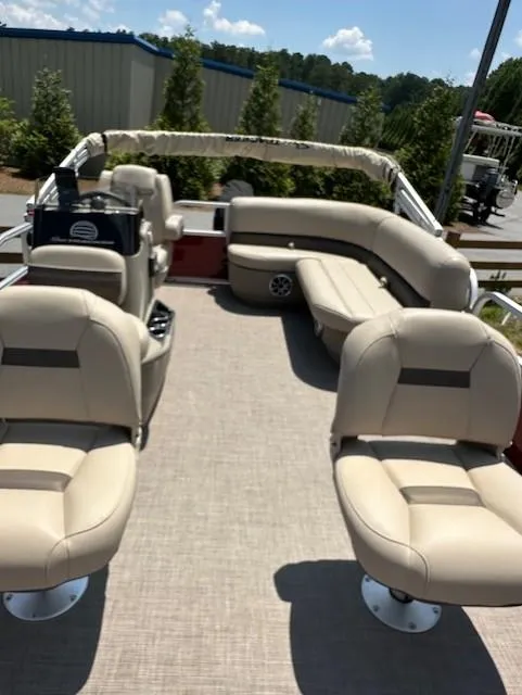 Slide: The Image of 2024 Sun Tracker Bass Buggy 16 XL Select pontoon boat with beige seating and spacious deck. - 7