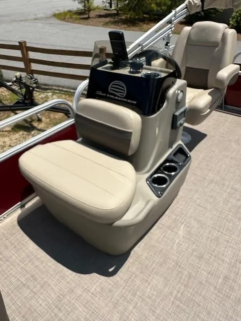 Slide: The Image of 2024 Sun Tracker Bass Buggy 16 XL Select boat interior with beige seating and control console. - 8