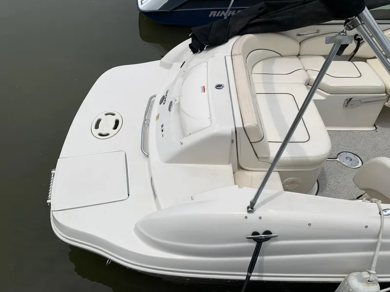 Slide: The Image of 2008 Sea Ray 200 Sundeck boat with white seating and swim platform. - 9