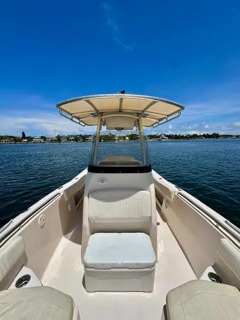 Slide: The Image of 2012 Grady-White Fisherman 230 boat on calm water under clear blue sky. - 12