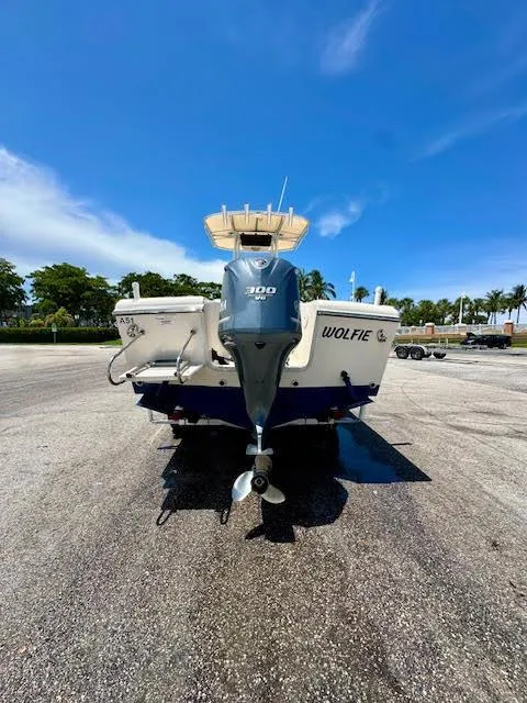 Slide: The Image of 2012 Grady-White Fisherman 230 boat with Yamaha 300 engine, parked on asphalt under blue sky. - 17