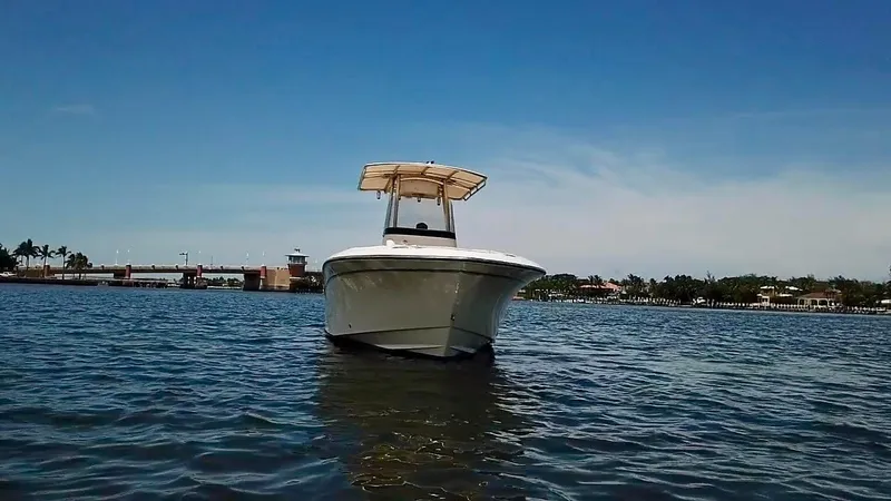 Slide: The Image of 2012 Grady-White Fisherman 230 boat on calm water under clear blue sky. - 7