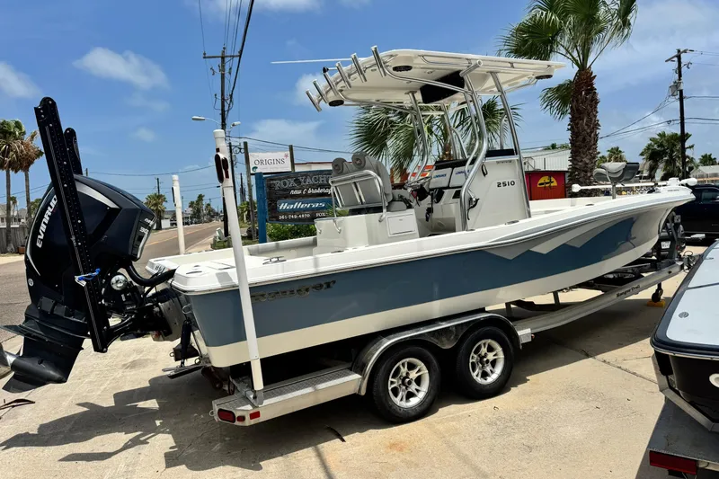 Slide: The Image of 2016 Ranger 2510 Bay Ranger boat on trailer, parked outdoors under clear sky. - 3
