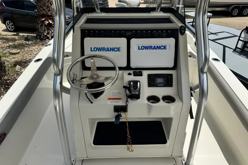 Slide: The Image of 2016 Ranger 2510 Bay Ranger boat console with Lowrance electronics and steering wheel. - 5