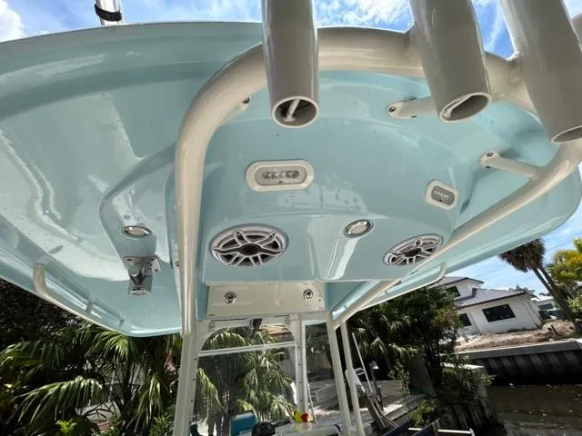 Slide: The Image of 2022 Cobia 240 Center Console boat interior with compact marine toilet. - 23