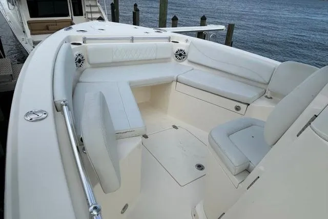 Slide: The Image of 2022 Cobia 240 Center Console boat with spacious seating and sleek design. - 35