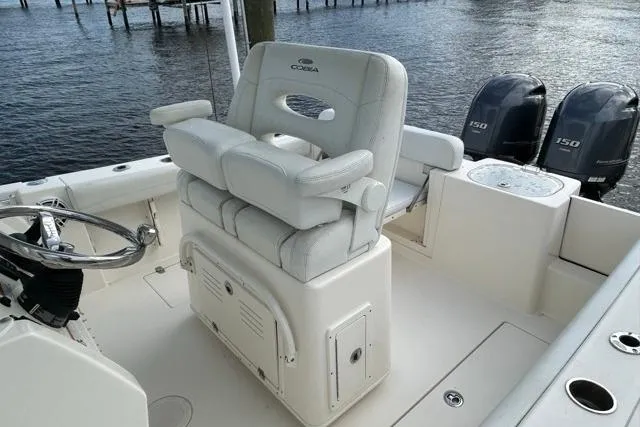 Slide: The Image of 2022 Cobia 240 Center Console boat with dual engines and comfortable seating. - 36