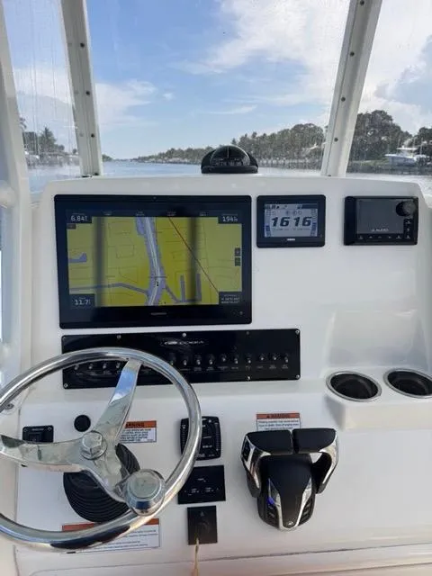 Slide: The Image of Close-up of a 2022 Cobia 240 Center Console boat component with "Revolution" label. - 4