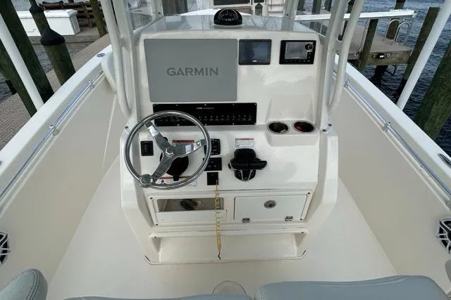 Slide: The Image of 2022 Cobia 240 Center Console boat dashboard with Garmin navigation system. - 40