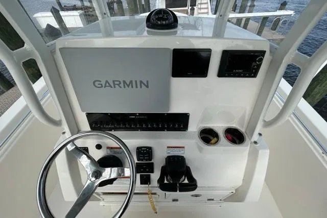 Slide: The Image of 2022 Cobia 240 Center Console boat dashboard with Garmin navigation system. - 48