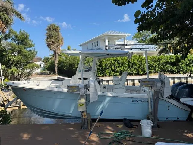 Slide: The Image of 2022 Cobia 240 Center Console dashboard with navigation display and steering wheel. - 5