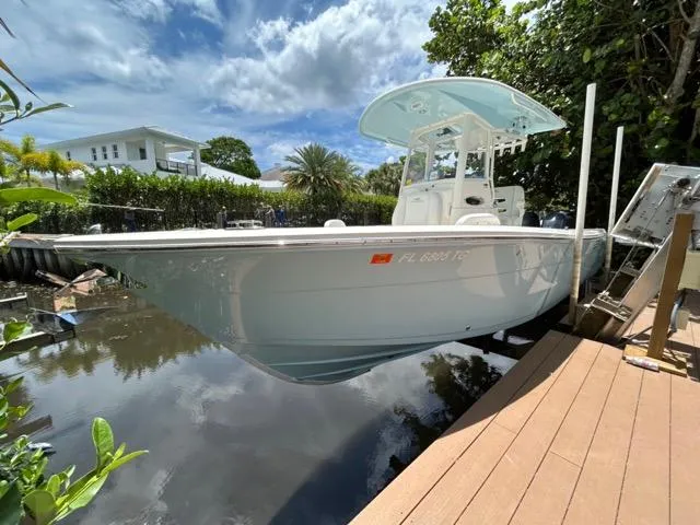 Slide: The Image of 2022 Cobia 240 Center Console boat interior with seating and console features. - 8