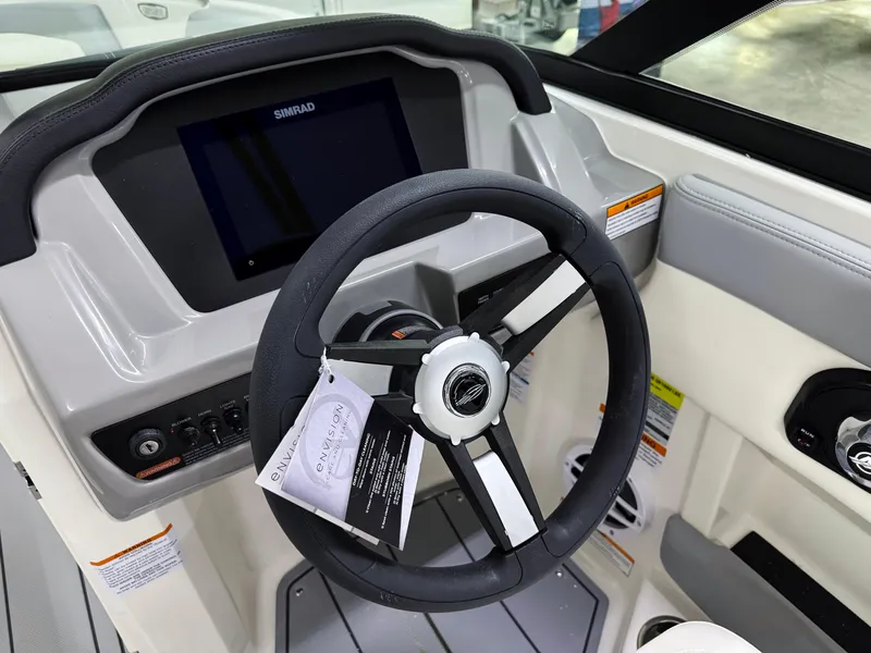 Slide: The Image of Steering wheel and dashboard of 2025 Chaparral 21 SSi boat with Simrad display. - 10