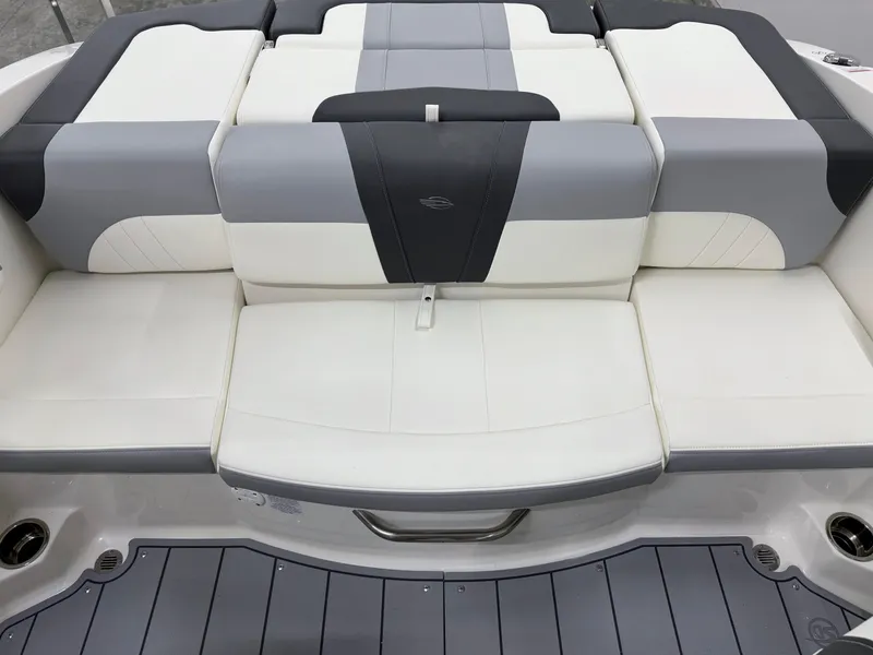 Slide: The Image of 2025 Chaparral 21 SSi boat interior with gray and white cushioned seating. - 17