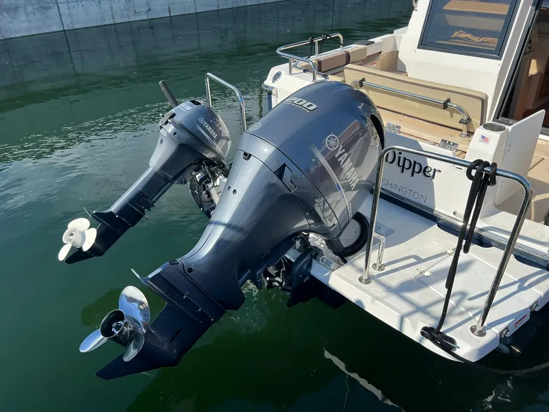 Slide: The Image of 2018 Ranger Tugs R23 boat with dual Yamaha outboard motors on water. - 11