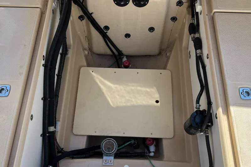 Slide: The Image of 2018 Ranger Tugs R23 boat interior showing engine compartment and wiring. - 21