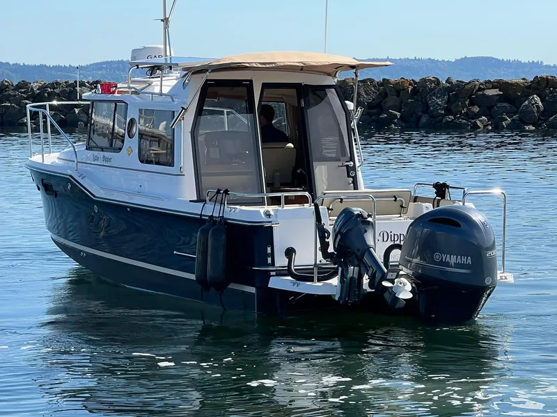 Slide: The Image of 2018 Ranger Tugs R23 boat with Yamaha outboard motor on calm water. - 8