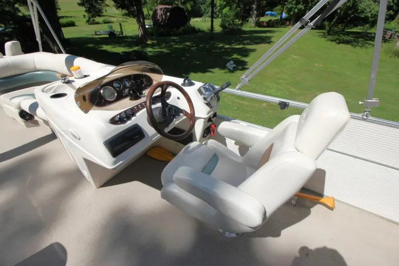 Slide: The Image of 2002 Princecraft Versailles 22 SS boat interior with steering wheel and control panel. - 15
