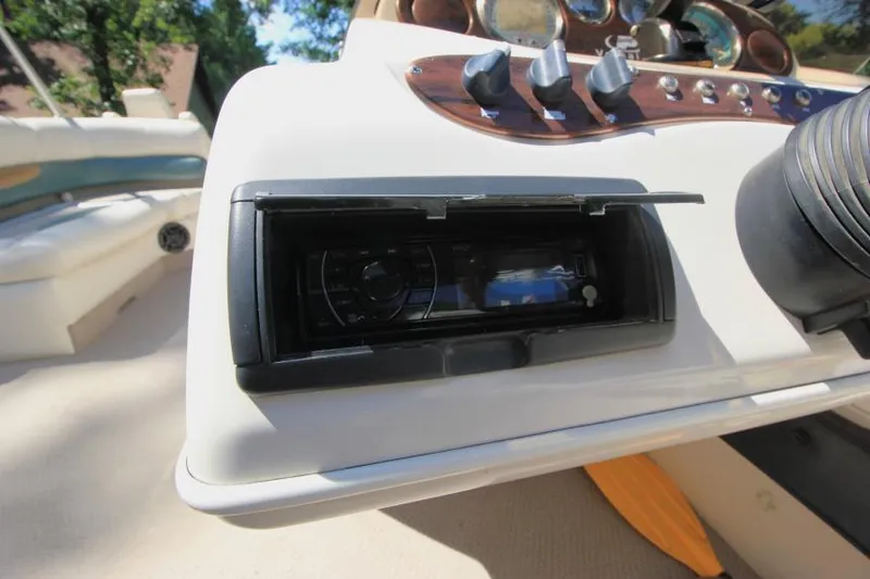Slide: The Image of 2002 Princecraft Versailles 22 SS dashboard with stereo system and control panel. - 17