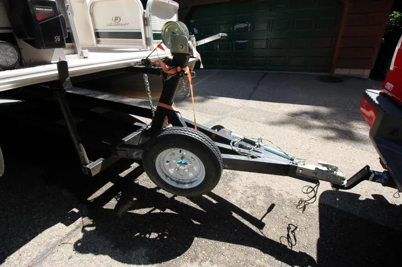 Slide: The Image of Trailer hitch of 2002 Princecraft Versailles 22 SS boat, parked in driveway. - 3