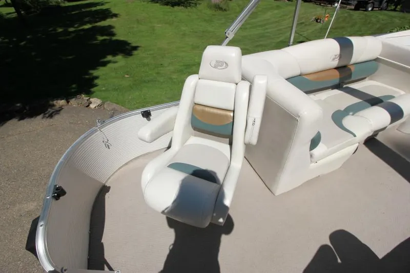 Slide: The Image of 2002 Princecraft Versailles 22 SS boat interior with white and beige seating. - 8