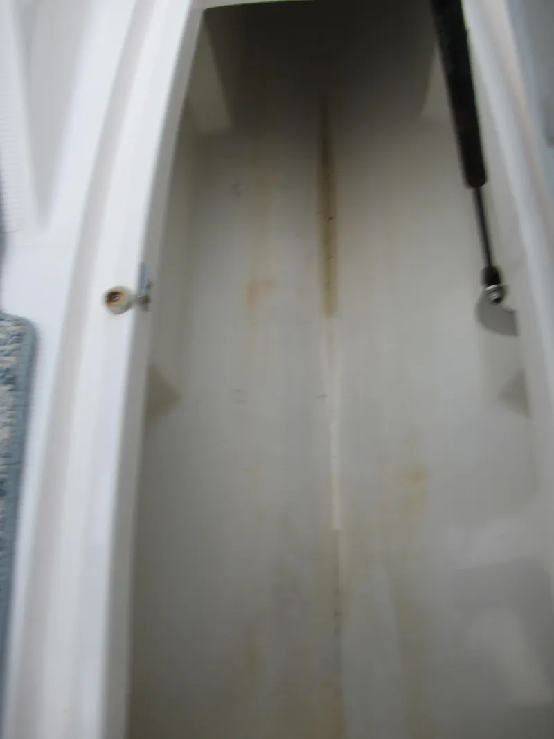 Slide: The Image of Storage compartment of a 2004 Yamaha Boats SX230. - 13