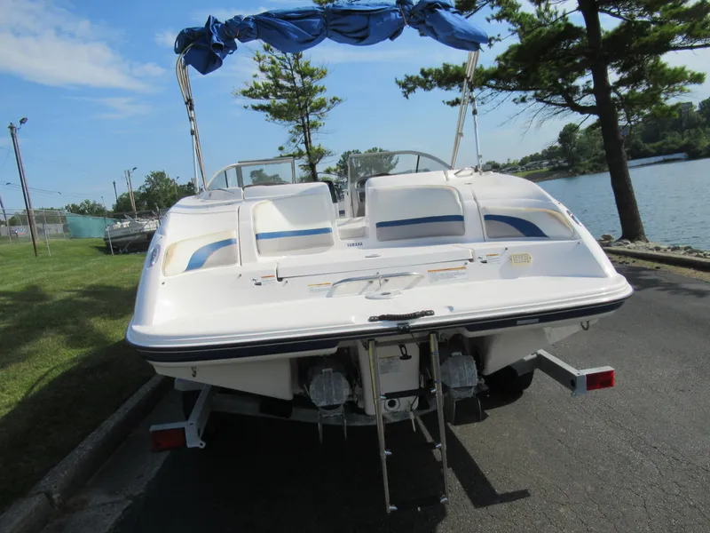 Slide: The Image of 2004 Yamaha Boats SX230 on trailer by lakeside. - 2